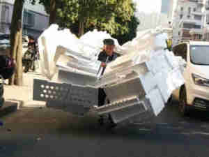 Funny China Delivery Bike guy with overloaded foam