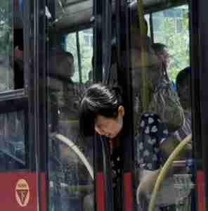 Funny China Head Stuck In Bus